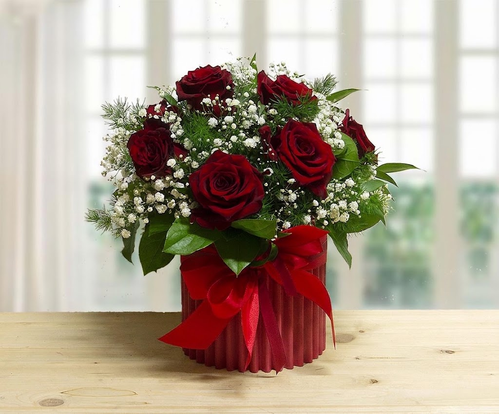 Scatola rosa di 9 rose rosse